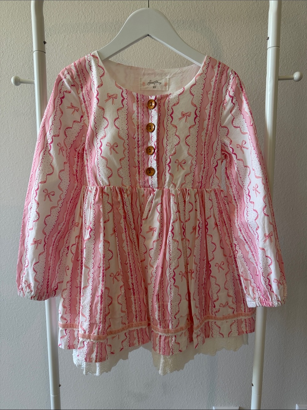 SweetHoney Pink and White Bow-Print Long-Sleeve Peplum Top